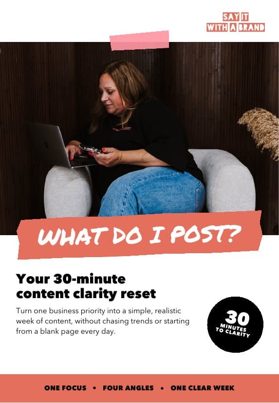 The front cover of the free guide: What do I post? Your 30-minute content clarity reset, with Jo working on her laptop